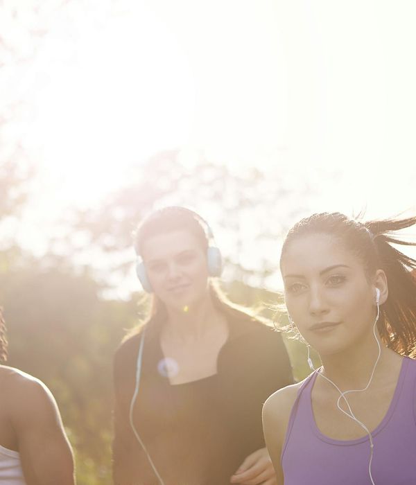 Woman feeling energized and happy during a light workout outdoors.